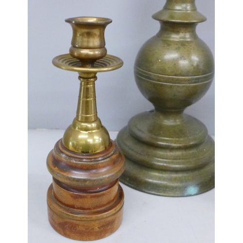 707 - Three candlesticks including one mounted on a wooden plinth