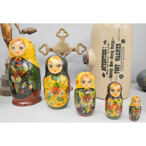 709 - A Russian doll, brass crucifix, foot warmer, a pair of cold painted spelter figures, four decorative... 