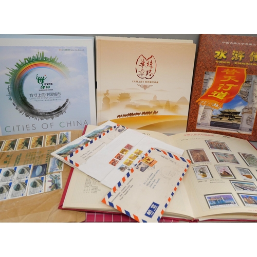 718 - Stamps; four China stamp books plus some postal history