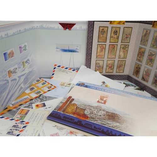 718 - Stamps; four China stamp books plus some postal history