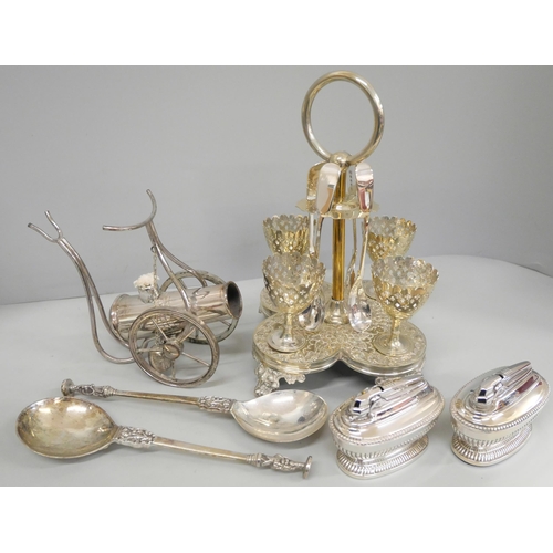 720 - A box of silver plate, a set of four egg cups and stand, cocktail shaker, brandy warmer with glass a... 