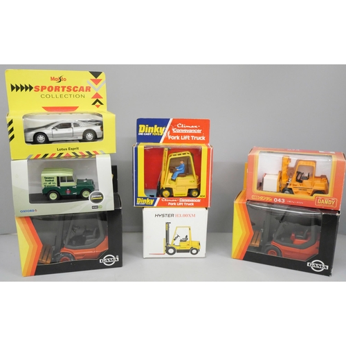 737 - Five boxed model fork-lift trucks including Dinky Toys 404 and two other model vehicles