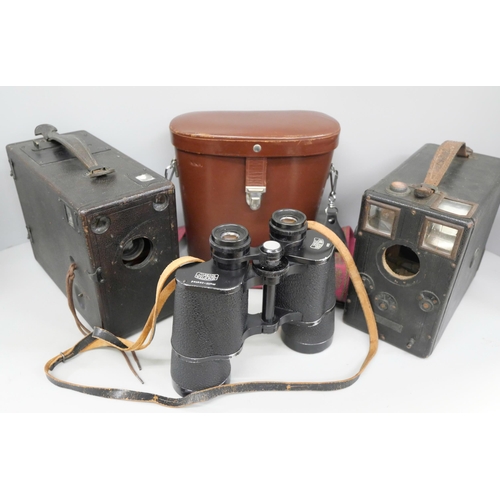 748 - A pair of 10x50 Zeiss binoculars, cased, and two vintage cameras, one a/f