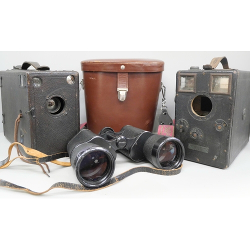 748 - A pair of 10x50 Zeiss binoculars, cased, and two vintage cameras, one a/f