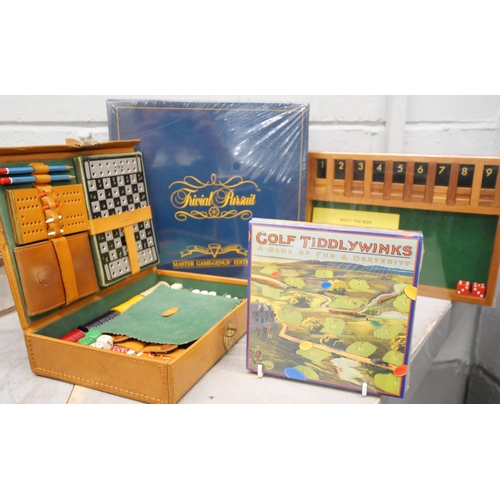 760 - A collection of games including Trivial Pursuit master game, genius edition (sealed), Shut the Box, ... 