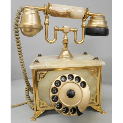 773 - An onyx telephone and coffee pot, (phone chipped)