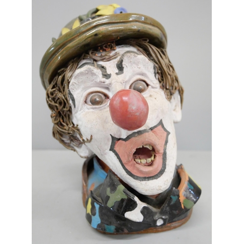 775 - A studio pottery bust of a clown