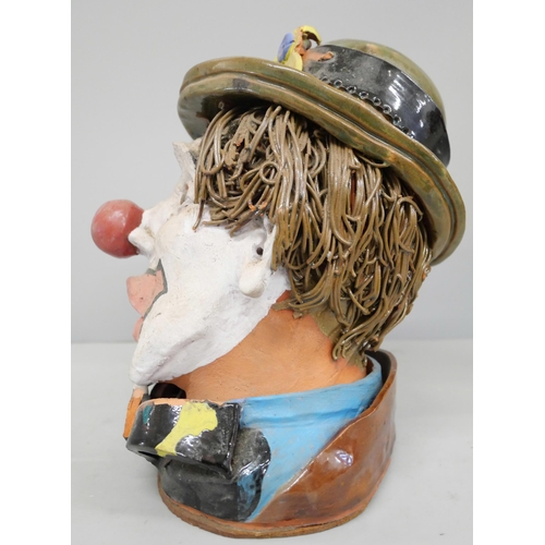 775 - A studio pottery bust of a clown