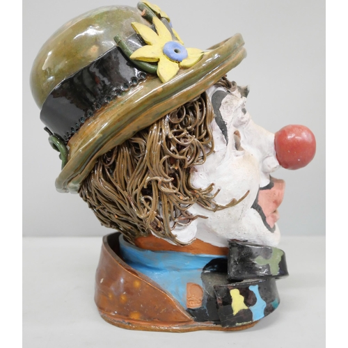 775 - A studio pottery bust of a clown