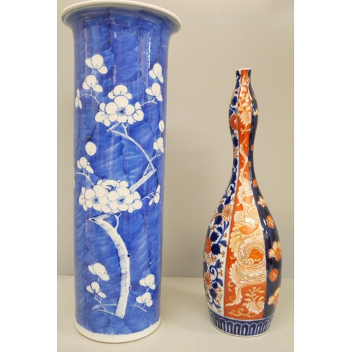 784 - A 19th Century Japanese Imari vase and a Chinese blue and white cylindrical vase, (blue vase 36cm an... 