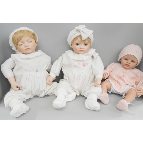 795 - An Ashton Drake doll, 'Abby Rose' and two other dolls without certificates, together with dolls clot... 