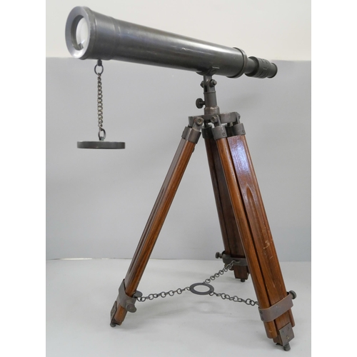 800 - A brass telescope on wooden tripod stand