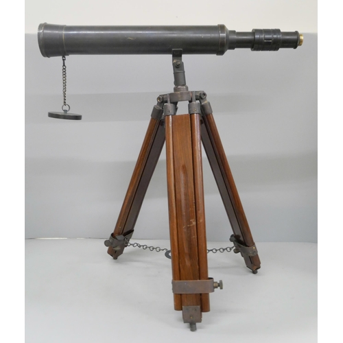 800 - A brass telescope on wooden tripod stand