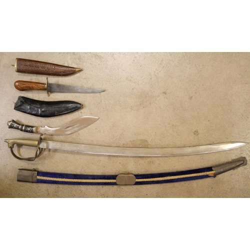 803 - An Indian sword, Kukri and carving set