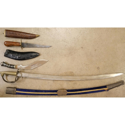 803 - An Indian sword, Kukri and carving set