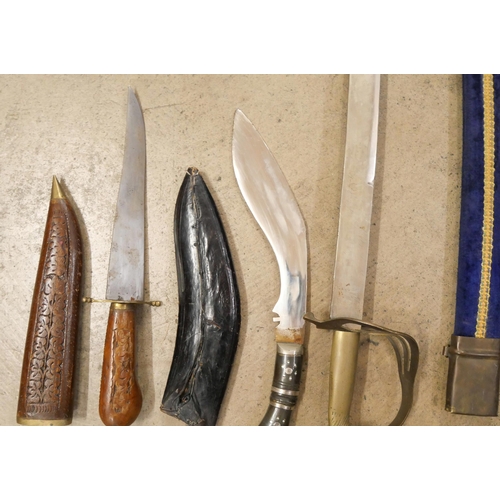 803 - An Indian sword, Kukri and carving set