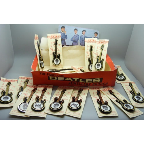 806 - The Beatles, a shop box containing 19 Invicta Plastics guitar brooches on card