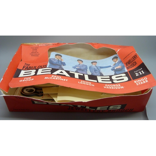 806 - The Beatles, a shop box containing 19 Invicta Plastics guitar brooches on card