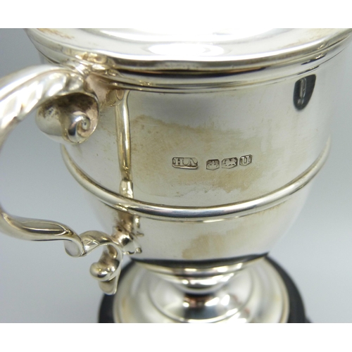 816 - Two silver engraved golf trophies - lidded example Sheffield 1937, and Birmingham 1939, tallest 14cm... 