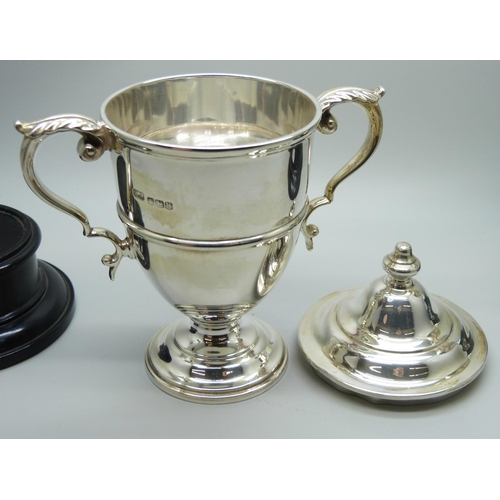 816 - Two silver engraved golf trophies - lidded example Sheffield 1937, and Birmingham 1939, tallest 14cm... 