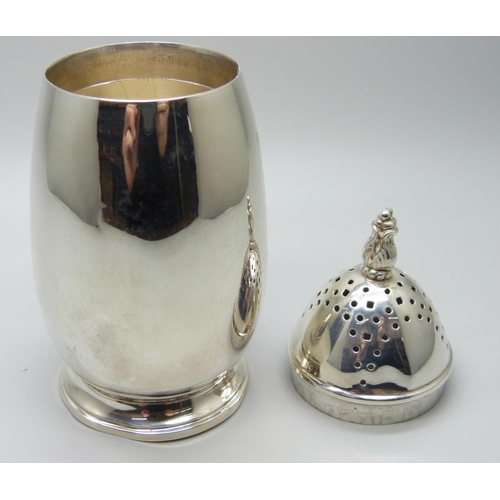 821 - A silver sugar shaker, Birmingham 1936, 13.5cm, 105g, dented