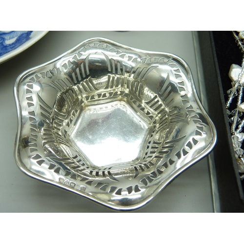 822 - A collection of silver including a silver mounted Oriental cup and dish, a pierced silver bon bon di... 