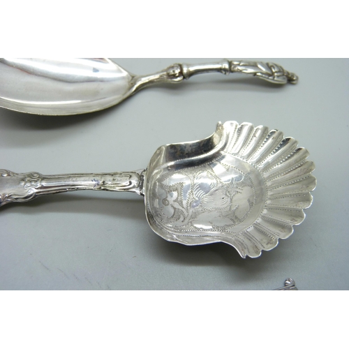 831 - A silver caddy spoon, Birmingham 1825, Joseph Taylor, two silver mustard spoons and one other silver... 