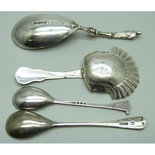 831 - A silver caddy spoon, Birmingham 1825, Joseph Taylor, two silver mustard spoons and one other silver... 