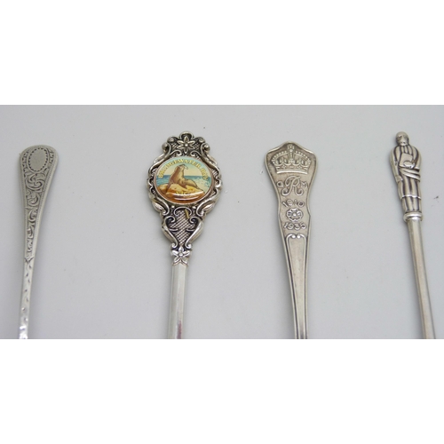 832 - A collection of silver spoons, sugar nips, and a pickle fork, 53g, together with a plated spoon