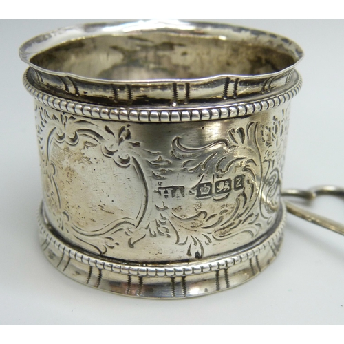 836 - A silver tea strainer and two silver napkin rings, 73g