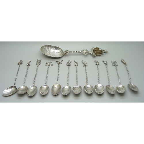 837 - A set of 12 white metal spoons with Continental control marks, one a/f, and a large white metal spoo... 