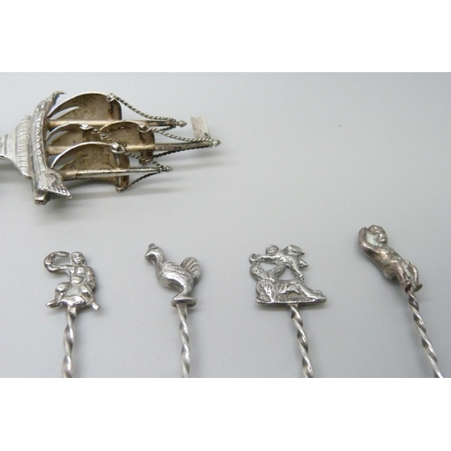 837 - A set of 12 white metal spoons with Continental control marks, one a/f, and a large white metal spoo... 