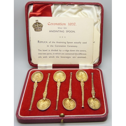 838 - A cased set of six silver gilt anointing spoons, Coronation 1937 replicas, 55g, cased