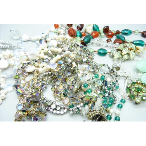 846 - A collection of vintage costume jewellery and a long string of pearls