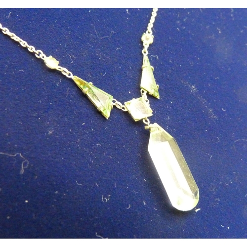 849 - A c1920s Art Deco green crystal necklace, stones a/f, clasp marked 'platinon'