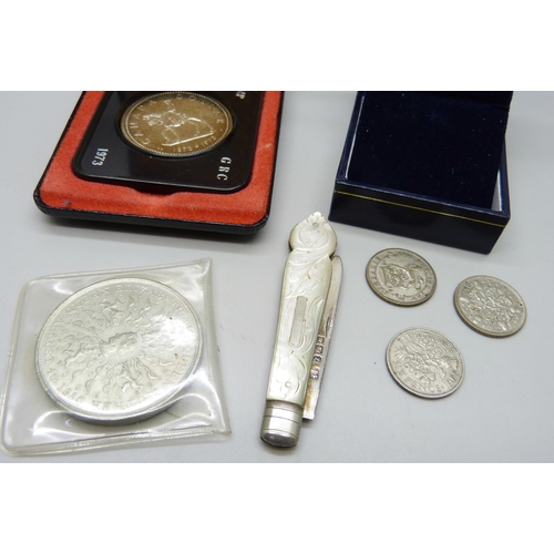 850 - A silver and mother of pearl fruit knife, two half silver coins, an Armed Forces veteran badge, a cr... 