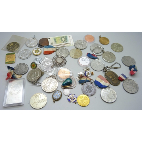 852 - A collection of medallions, coins, pendants, badges, etc.