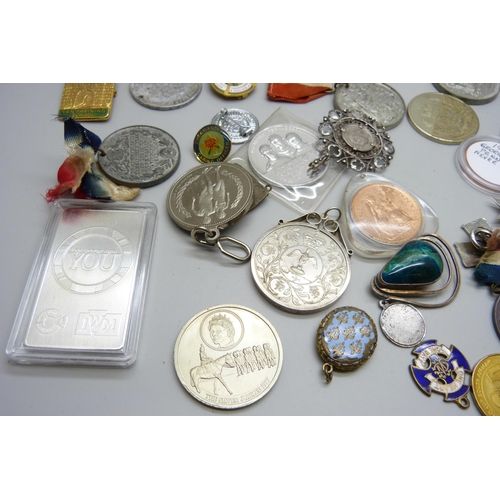 852 - A collection of medallions, coins, pendants, badges, etc.