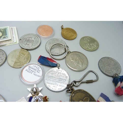 852 - A collection of medallions, coins, pendants, badges, etc.