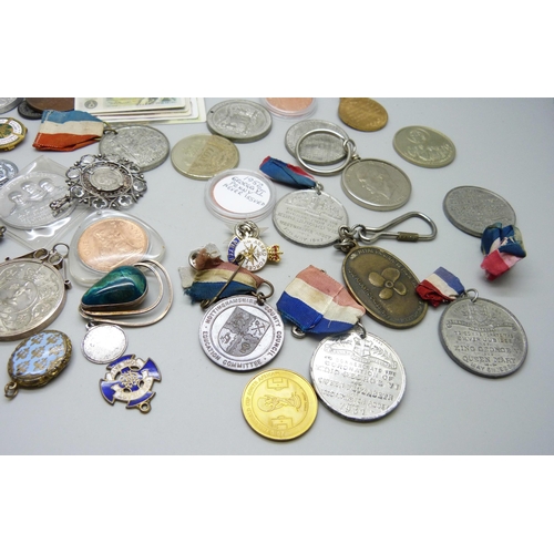 852 - A collection of medallions, coins, pendants, badges, etc.