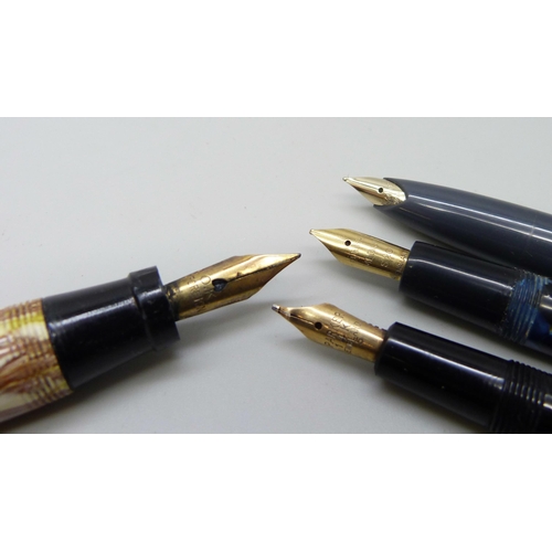 860 - A collection of pens - two Wyvern fountain pens with gold nibs, two Parker pens with gold nibs and t... 