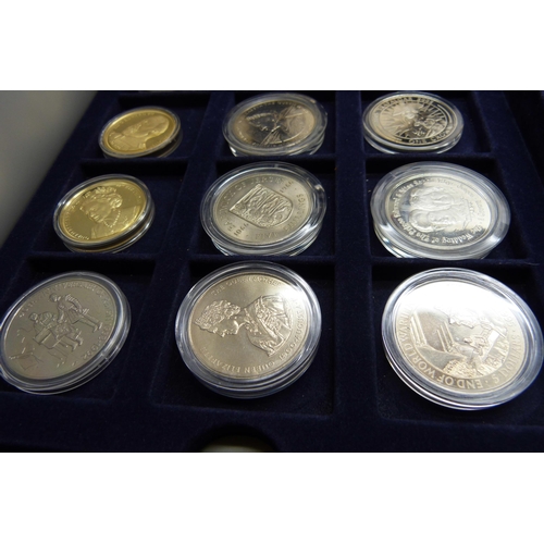 872 - A cased collection of 36 crown size coins including commemorative