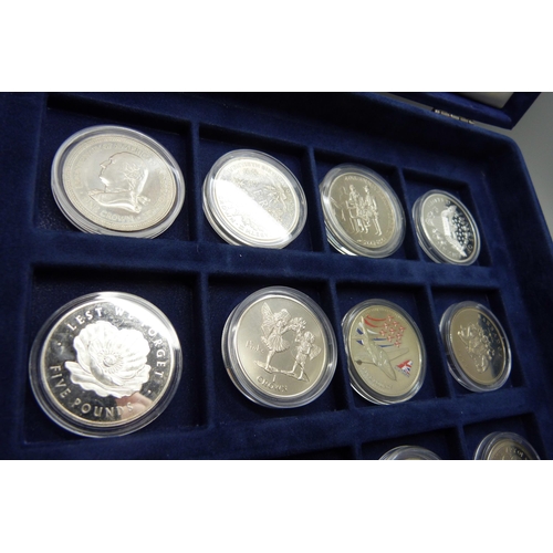 872 - A cased collection of 36 crown size coins including commemorative