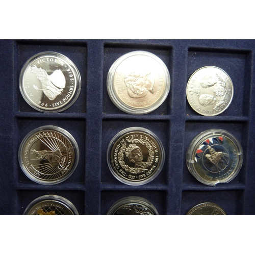 873 - A cased collection of 36 crown size coins including commemorative