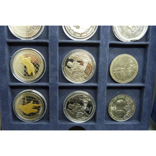 873 - A cased collection of 36 crown size coins including commemorative