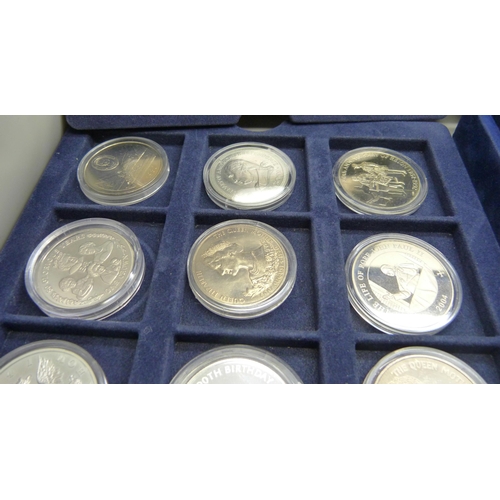 873 - A cased collection of 36 crown size coins including commemorative