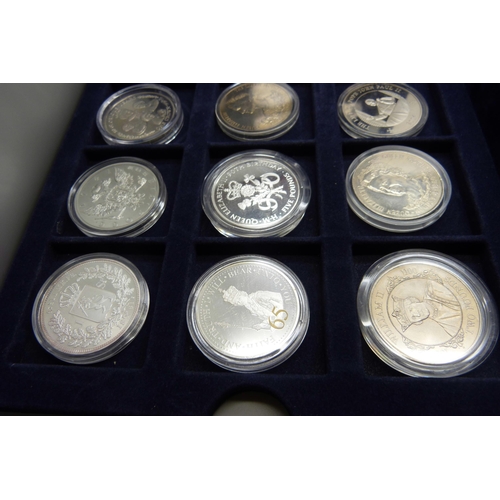 873 - A cased collection of 36 crown size coins including commemorative