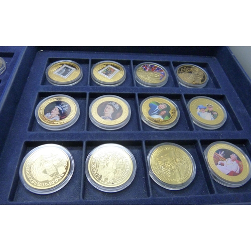 873 - A cased collection of 36 crown size coins including commemorative