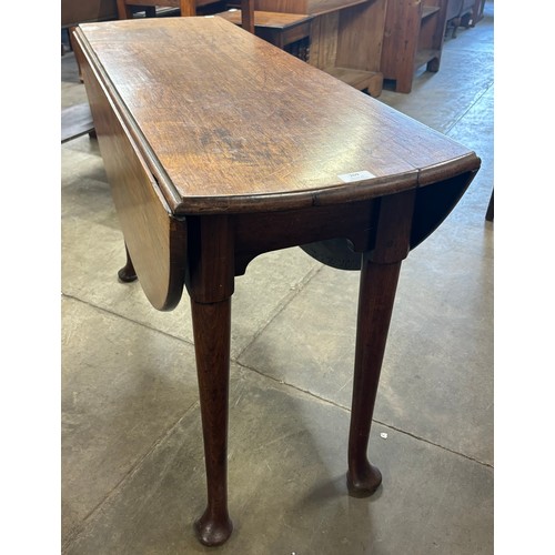 209 - A George II mahogany drop-leaf dining table