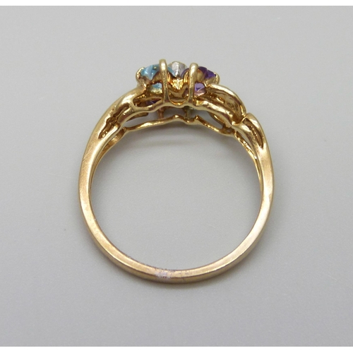 889 - A 9ct gold ring set with a small central diamond, amethyst and topaz, 2.9g, Q/R